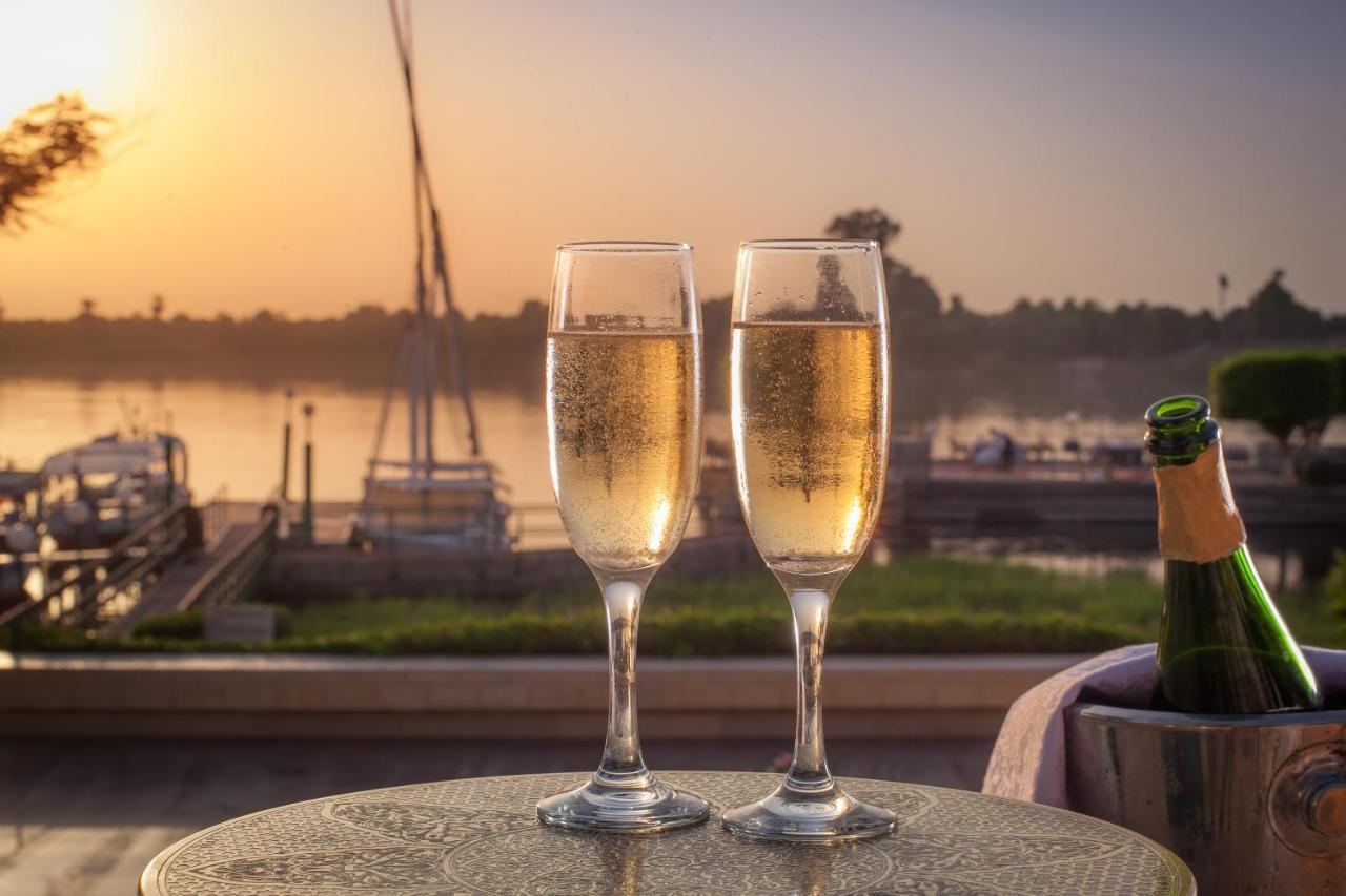 Jolie Ville Hotel & Spa Kings Island Луксор Екстер'єр фото Two champagne flutes